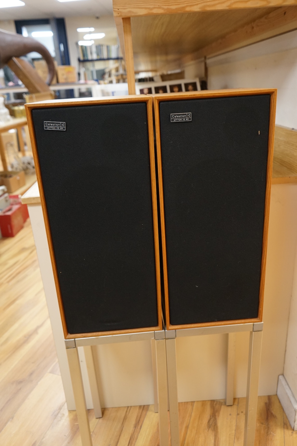 A pair of Celestion Ditton 15XR stereo speakers attached to stands, speakers; 56cm high, 25cm wide, 24cm deep, overall height including the stands 110cm.